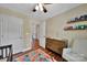 Well-organized Bedroom with a changing table dresser, hardwood floors, and a cozy chair at 413 Hurston Cir, Charlotte, NC 28208
