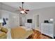 Bedroom featuring hardwood floors, closet, and white dresser with tv on top at 413 Hurston Cir, Charlotte, NC 28208