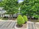 Well-maintained townhouse with mature trees and landscaping in a desirable location with parking at 413 Hurston Cir, Charlotte, NC 28208
