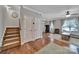 Inviting foyer with hardwood floors, staircase, and plenty of natural light at 413 Hurston Cir, Charlotte, NC 28208