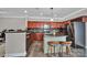 Well-equipped kitchen features stainless steel appliances, dark granite countertops, a breakfast bar, and ample cabinet space at 413 Hurston Cir, Charlotte, NC 28208