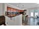 Stylish kitchen featuring dark granite countertops, stainless steel appliances, and a breakfast bar at 413 Hurston Cir, Charlotte, NC 28208