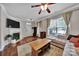 Bright and airy living area with fireplace, large windows, hardwood floors, and cozy decor at 413 Hurston Cir, Charlotte, NC 28208