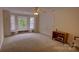 Bright bedroom featuring a window seat, carpeted floor, and natural light at 495 Bay Harbour Rd, Mooresville, NC 28117