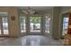 Breakfast nook featuring large windows with a view of the lake, tile flooring, and natural light at 495 Bay Harbour Rd, Mooresville, NC 28117
