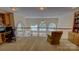 Second-story foyer overlooking arched windows featuring lake views, a ceiling fan, and neutral tones at 495 Bay Harbour Rd, Mooresville, NC 28117