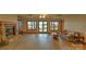 Inviting living room with a stone fireplace, wood-look floors, and sliding glass doors to the yard at 495 Bay Harbour Rd, Mooresville, NC 28117