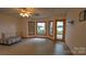 Spacious living room with view of the lake from the large windows and sliding door at 495 Bay Harbour Rd, Mooresville, NC 28117