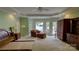 Spacious main bedroom with bay windows and an attached private door leading to the outside with a lake view at 495 Bay Harbour Rd, Mooresville, NC 28117