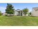 The grassy backyard includes a screened in patio, perfect for enjoying the outdoors in comfort at 5076 Newport Lakes Dr, Rock Hill, SC 29732