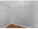 Walk-in closet features wire shelving and hardwood floors at 5076 Newport Lakes Dr, Rock Hill, SC 29732