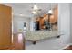 Kitchen with granite countertops, wood cabinets, a ceiling fan, and stainless steel appliances at 5076 Newport Lakes Dr, Rock Hill, SC 29732