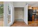 Inside utility/laundry area featuring hardwood flooring, washer hookups, and french door to the outside at 5076 Newport Lakes Dr, Rock Hill, SC 29732