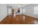 Open-concept living area featuring hardwood floors and seamless flow into the kitchen at 5076 Newport Lakes Dr, Rock Hill, SC 29732