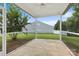 A screened patio with a ceiling fan offers a comfortable outdoor space and lovely views of the backyard at 5076 Newport Lakes Dr, Rock Hill, SC 29732