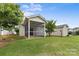 The backyard features a screened patio, perfect for enjoying the outdoors with shade and breeze at 5076 Newport Lakes Dr, Rock Hill, SC 29732