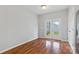 Neutral room with hardwood flooring and double doors leading to the outside at 5076 Newport Lakes Dr, Rock Hill, SC 29732