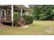 Inviting back porch with well-maintained steps and manicured landscaping at 508 Flour Mill Ct, Fort Mill, SC 29715