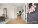 Inviting foyer featuring hardwood floors, an open doorway to the dining room, and a view to the living area at 508 Flour Mill Ct, Fort Mill, SC 29715