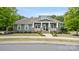 Charming single-story home featuring a welcoming front porch, manicured lawn, and beautiful landscaping at 508 Flour Mill Ct, Fort Mill, SC 29715