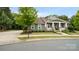 Inviting one-story home showcasing a lovely front porch, well-maintained lawn, and lush greenery at 508 Flour Mill Ct, Fort Mill, SC 29715