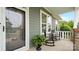 Cozy front porch with rocking chairs, decorative planters, and a view of the home's exterior at 508 Flour Mill Ct, Fort Mill, SC 29715