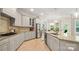 Open kitchen with granite counters, stainless appliances, and an inviting layout for cooking and entertaining at 508 Flour Mill Ct, Fort Mill, SC 29715