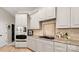 Well-equipped kitchen featuring stainless steel appliances, tiled backsplash, and ample cabinet space at 508 Flour Mill Ct, Fort Mill, SC 29715