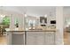 Modern kitchen island with granite countertop and stainless steel dishwasher at 508 Flour Mill Ct, Fort Mill, SC 29715