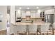 Beautiful kitchen with granite countertops, stainless steel appliances, and a breakfast bar at 508 Flour Mill Ct, Fort Mill, SC 29715