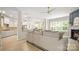 Bright, open-concept living room with hardwood floors, modern fireplace, and seamless flow to kitchen and dining area at 508 Flour Mill Ct, Fort Mill, SC 29715