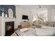 Cozy living room featuring a fireplace, media console, and comfortable seating arrangement at 508 Flour Mill Ct, Fort Mill, SC 29715