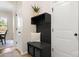 Welcoming mudroom featuring a stylish built-in bench with storage and coat hooks, adding functionality to the entryway at 508 Flour Mill Ct, Fort Mill, SC 29715