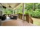Covered patio with comfortable seating and a view of the wooded backyard at 508 Flour Mill Ct, Fort Mill, SC 29715
