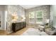 Chic sitting room with decorative wallpaper, stylish sideboard, and natural light from the window at 508 Flour Mill Ct, Fort Mill, SC 29715