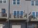 A stylish balcony features a seating area with a small table, perfect for relaxing outdoors at 5512 Swaling St, Charlotte, NC 28217
