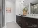 Modern bathroom featuring dual sinks, a spacious vanity, and a glass-enclosed shower at 5512 Swaling St, Charlotte, NC 28217