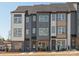 New construction townhome featuring a mix of brick and siding with a modern design at 5512 Swaling St, Charlotte, NC 28217