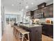 Modern kitchen featuring a spacious island with seating, stainless steel appliances, and open concept design at 5517 Swaling St, Charlotte, NC 28217