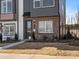 Charming townhome featuring brick accents and a stylish dark-colored front door at 5524 Swaling St, Charlotte, NC 28217