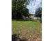 A charming backyard with a white shed next to the lake at 6006 White Store Rd, Marshville, NC 28103