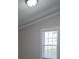 Bright bedroom featuring natural light from the window, neutral walls, and classic white trim at 6006 White Store Rd, Marshville, NC 28103