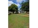 Nice yard with trees and house with vinyl siding and shutters at 6006 White Store Rd, Marshville, NC 28103