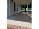 Inviting front porch with brick trim, leading to the front door of the home at 6006 White Store Rd, Marshville, NC 28103