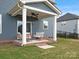 Cozy back porch featuring comfortable seating, ceiling fan, and stylish decor for outdoor relaxation at 6012 Millbridge Pkwy, Waxhaw, NC 28173