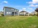 Spacious fenced backyard with lush green lawn, covered patio and ample space for recreation at 6012 Millbridge Pkwy, Waxhaw, NC 28173
