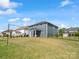 Spacious backyard with well-maintained lawn and volleyball net for outdoor recreation at 6012 Millbridge Pkwy, Waxhaw, NC 28173