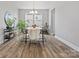 Bright dining room with modern chandelier, stylish furnishings, and ample natural light at 6012 Millbridge Pkwy, Waxhaw, NC 28173