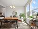 Bright dining room with natural light and an accent chandelier at 6012 Millbridge Pkwy, Waxhaw, NC 28173