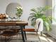 Well-lit dining space features a wood table, industrial-style chairs, and a decorative mirror at 6012 Millbridge Pkwy, Waxhaw, NC 28173